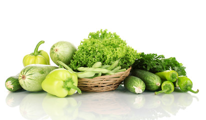 fresh green vegetables in basket isolated on white