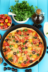 colorful composition of delicious pizza, vegetables and spices