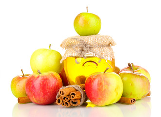 Honey and apples with cinnamon isolated on white
