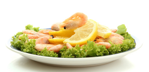 Boiled shrimps with lemon and lettuce leaves