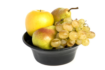 Fresh fruits in a black bawl isolated