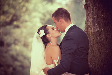 Wedding shot of bride and groom in park