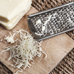 grated cheese and grater © librakv