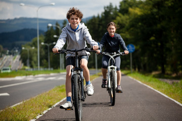 Girl and boy biking