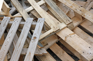pile of wooden pallets for transportation of material