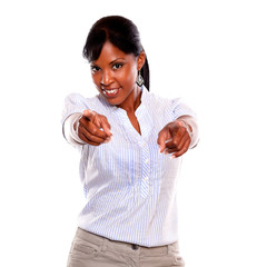 Ambitious young woman pointing and looking at you