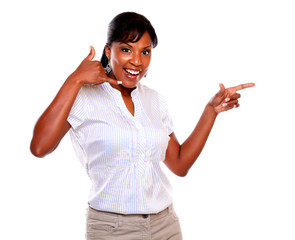 Smiling woman pointing left saying call me