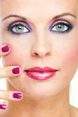 beautiful blond woman with stylish violet make-up