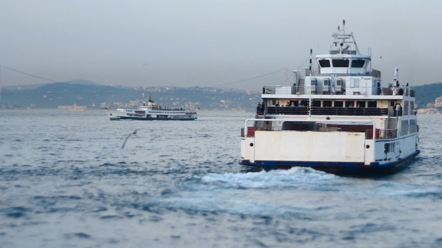  A ferryboat carries people and vehicles across bosphoros strait