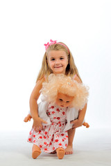 Pretty blonde girl and doll