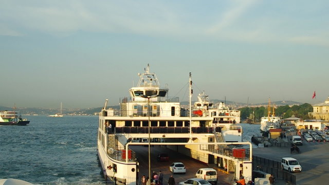 Cars and passengers boarding on to a ferry