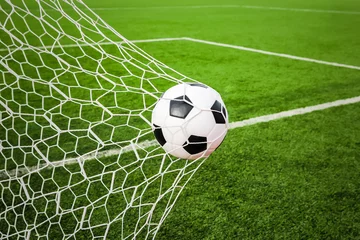 Keuken foto achterwand Voetbal football in the goal net