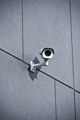 Security camera on office building wall - 45772635