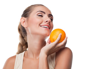 Close-up portrait of happy young woman with juice on white backg