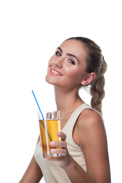 Close-up portrait of happy young woman with apple juice