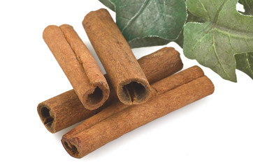 cinnamon sticks stacked on the white background