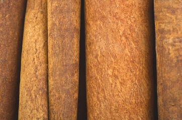 cinnamon sticks stacked on the white background