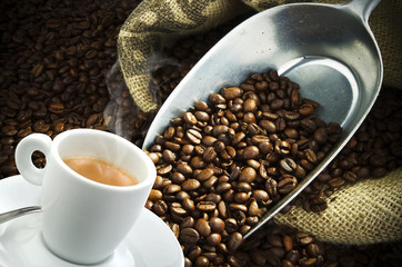 Coffee smoking on the coffee beans background