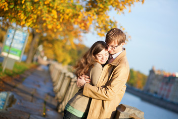 Fototapeta premium Happy couple in love on the Fontanka embankment in Saint-Petersb
