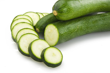 Fresh zucchini sliced close up on the white