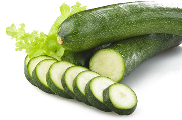 Fresh zucchini sliced close up on the white
