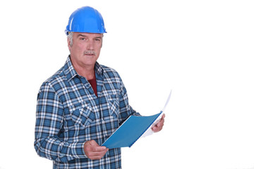 Foreman looking through paperwork