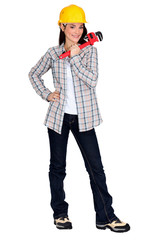 Tradeswoman holding a pipe wrench
