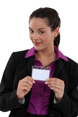Woman proudly displaying visitors badge
