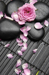 zen stones and rose on mat