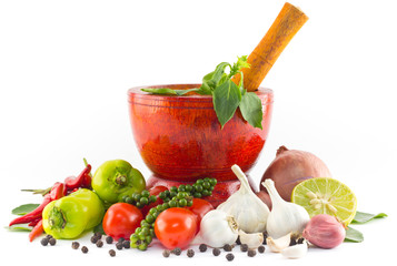 Fresh herbs and spices with wooden mortar