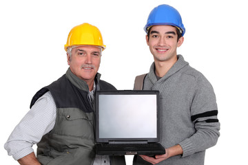 Tradesmen holding a laptop