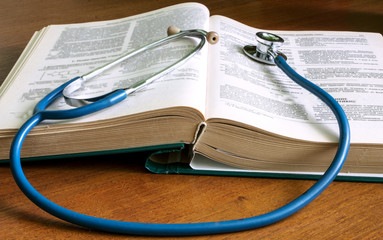 Stethoscope,  book, on a desktop