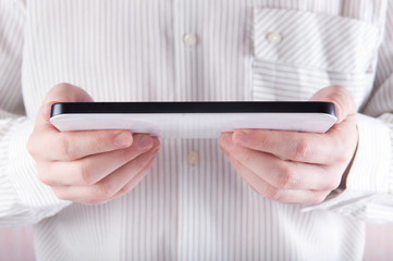 Young man holding digital tablet pc