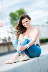 Fototapeta premium Portrait of a beautiful european woman smiling outdoors