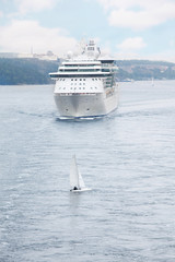 Big passenger ship and yacht floating near Stockholm