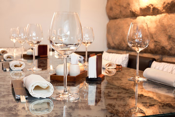 Glasses on table in sushi restaurant, focus on glass