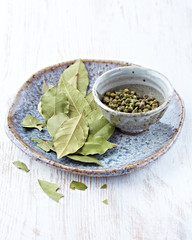 Bay leaves and green peppercorns