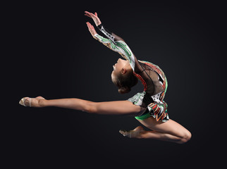 Young woman in gymnast suit posing