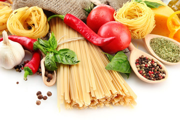 Pasta spaghetti, vegetables and spices, isolated on white