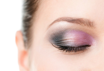 Obraz premium Close up of woman's closed eye with makeup 