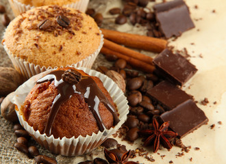tasty muffin cakes with chocolate, spices and coffee seeds,