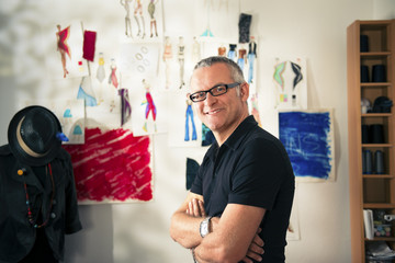 Portrait of happy woman working as fashion designer