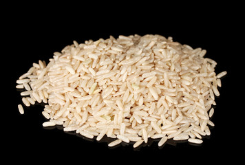 White unpolished rice isolated on black