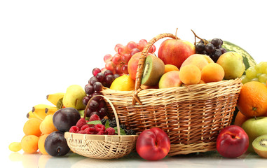 Assortment of exotic fruits and berries in baskets isolated