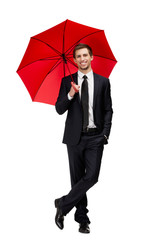Full length portrait of businessman with opened opened umbrella