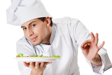 Portrait of chef cook handing salad dish, isolated on white