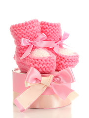 pink baby boots and gift isolated on white