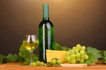 Bottle of great wine with glass and cheese