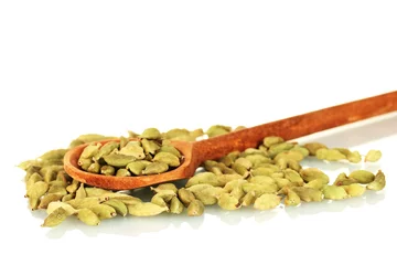Foto op Canvas green cardamom in wooden spoon on white background close-up © Africa Studio