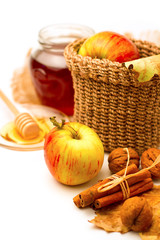 Apples and honey arrangement with autumn leaves